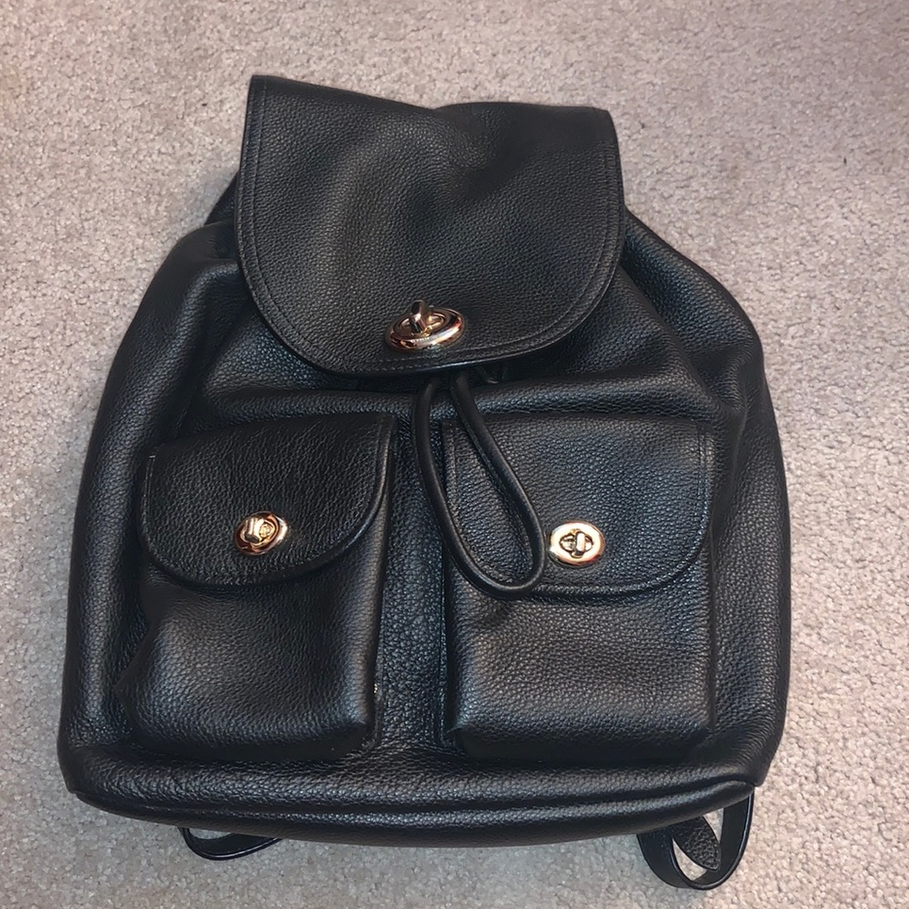Black coach backpack.